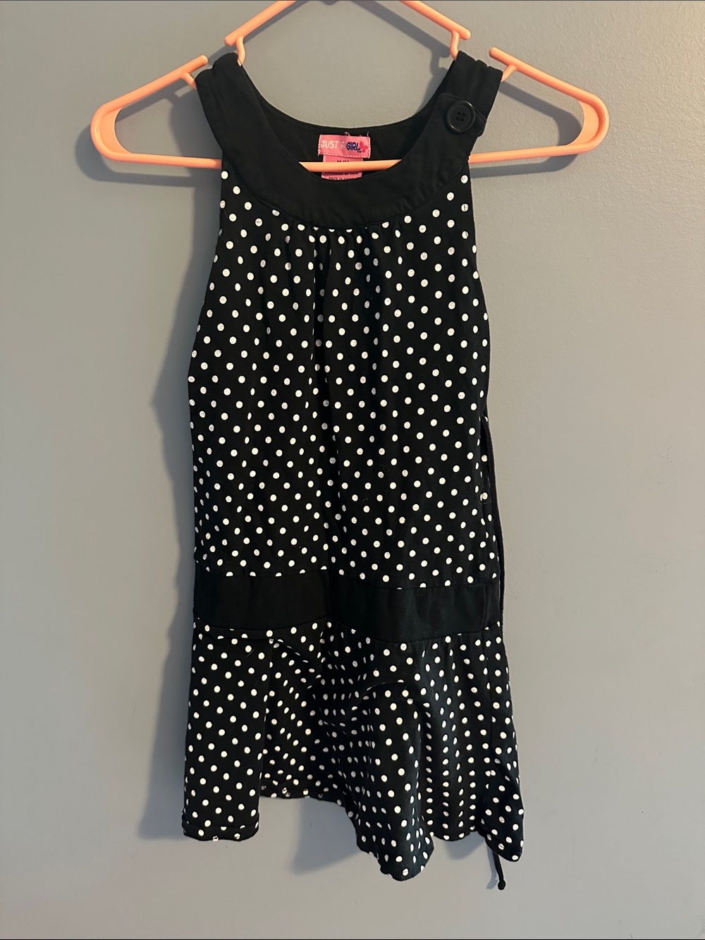 Black Polka Dot Girls' Dress with tie strings in back for a safe fit.